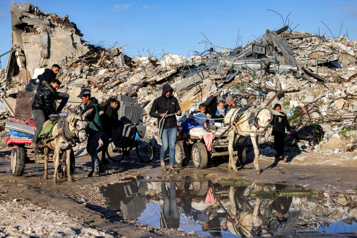 People displaced from Beit Lahia by a renewed Israeli offensive conflict arrive in Gaza City on March 22, 2025. (AFP)