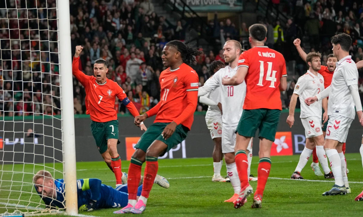 Portugal's Cristiano Ronaldo celebrates after Denmark's Joachim Andersen scored an own goal during the UEFA Nations League soccer match between Portugal and Denmark, at the Jose Alvalade Stadium in Lisbon, Sunday, March 23, 2025. (AP)