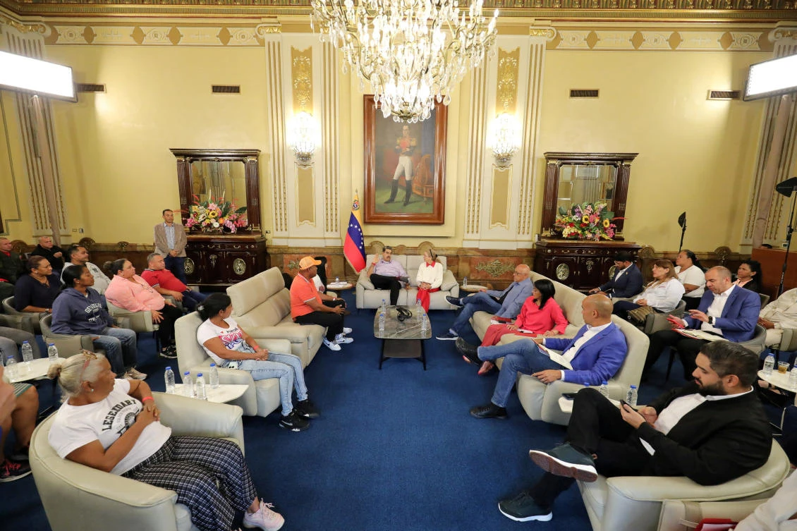 Venezuela President Nicolas Maduro and his wife Cilia Flores meet with family members of Venezuelans held in a high-security prison in El Salvador after being deported from the US on March 20, 2025. (Miraflores Palace via Reuters)