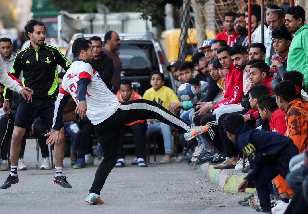 Players take part in a ‘Sock Ball’ match during a Ramadan soccer tournament held on a street in Alexandria, Mar. 23, 2025. (Reuters)