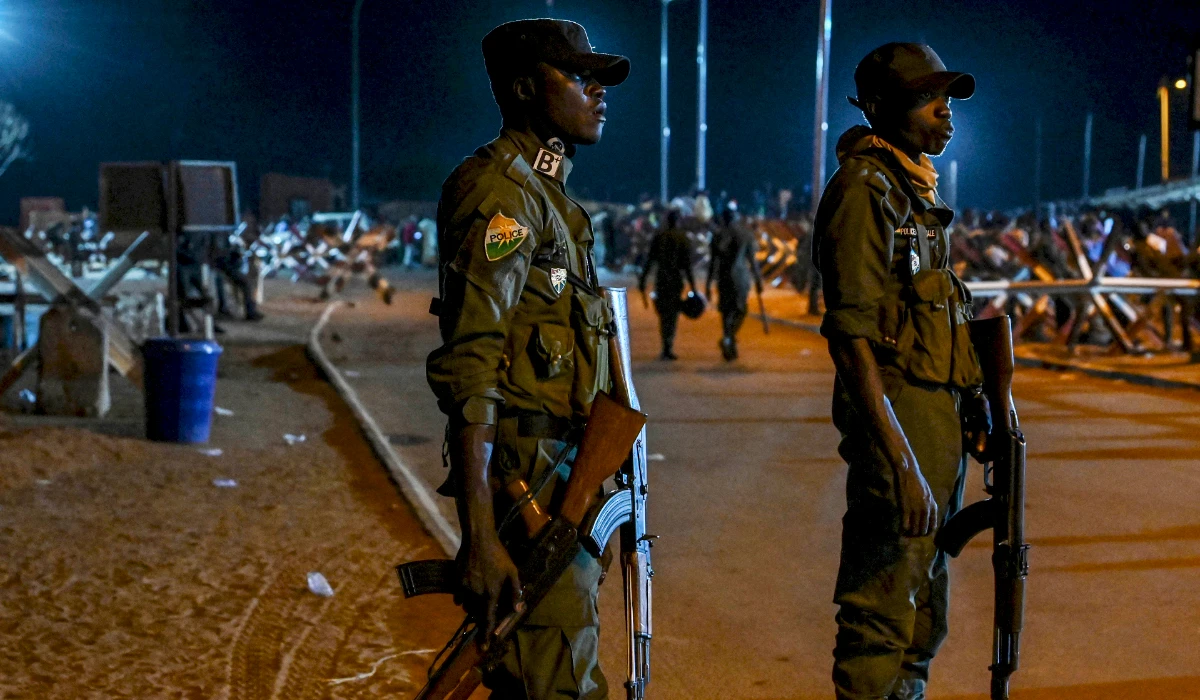 National police officers stand guard as supporters of Niger's National Council for Safeguard of the Homeland protest outside the French and Niger airbase in Niamey on September 9, 2023 to demand the departure of the French army from Niger. (AFP)