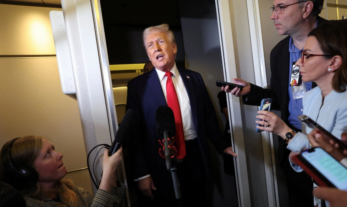 US President Donald Trump speaks to reporters aboard Air Force One on his return to Washington, DC, US, March 30, 2025. (Reuters)
