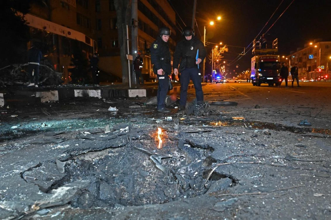 Russia bombed the city of Kharkiv in northeastern Ukraine for the second night in row. Above, Police officers stand near a crater following a drone attack in Kharkiv on March 29, 2025. (AFP)