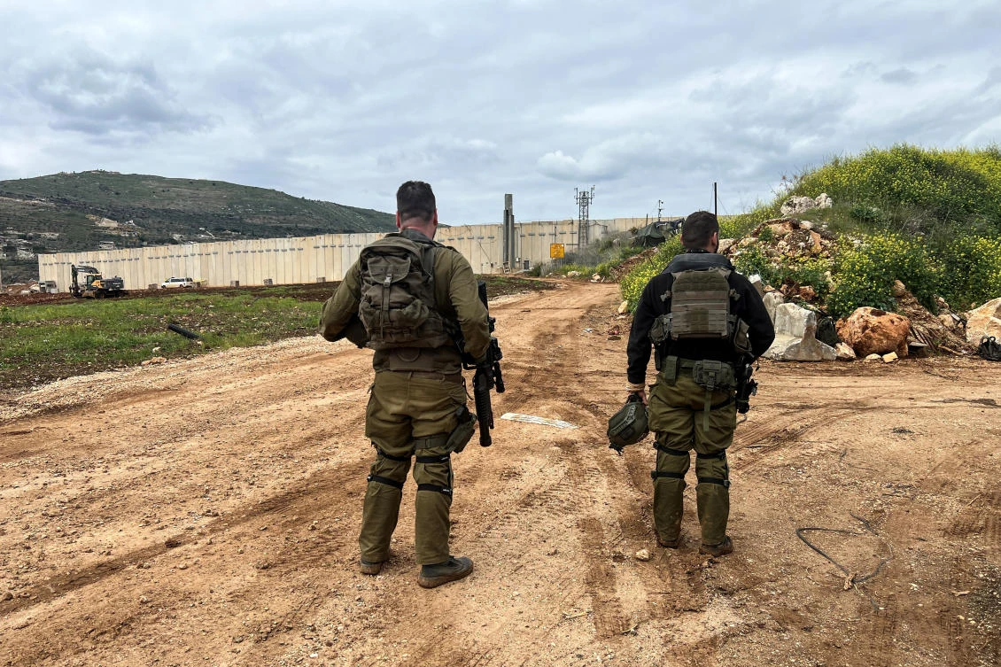Israeli soldiers stand at the Israeli side of the Israel-Lebanon border, March 22, 2025. (Reuters)
