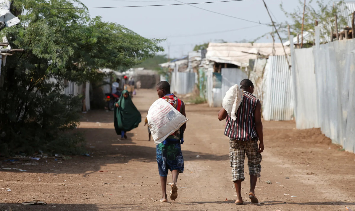 Men carry bags of food aid at the Kakuma refugee camp in northern Kenya. (Reuters/File)
