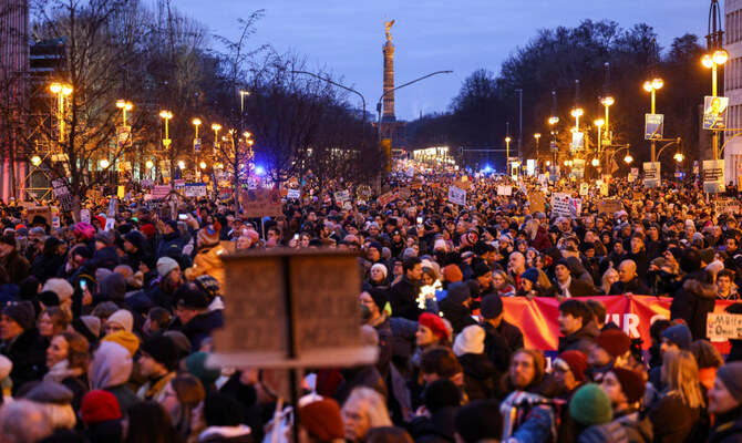 People march during a protest against the migration plans of the CDU party leader and top candidate for Chancellor Friedrich Merz and the far-right Alternative for Germany party (AfD), near Reichstag, in Berlin, Germany February 2, 2025. (Reuters/File)