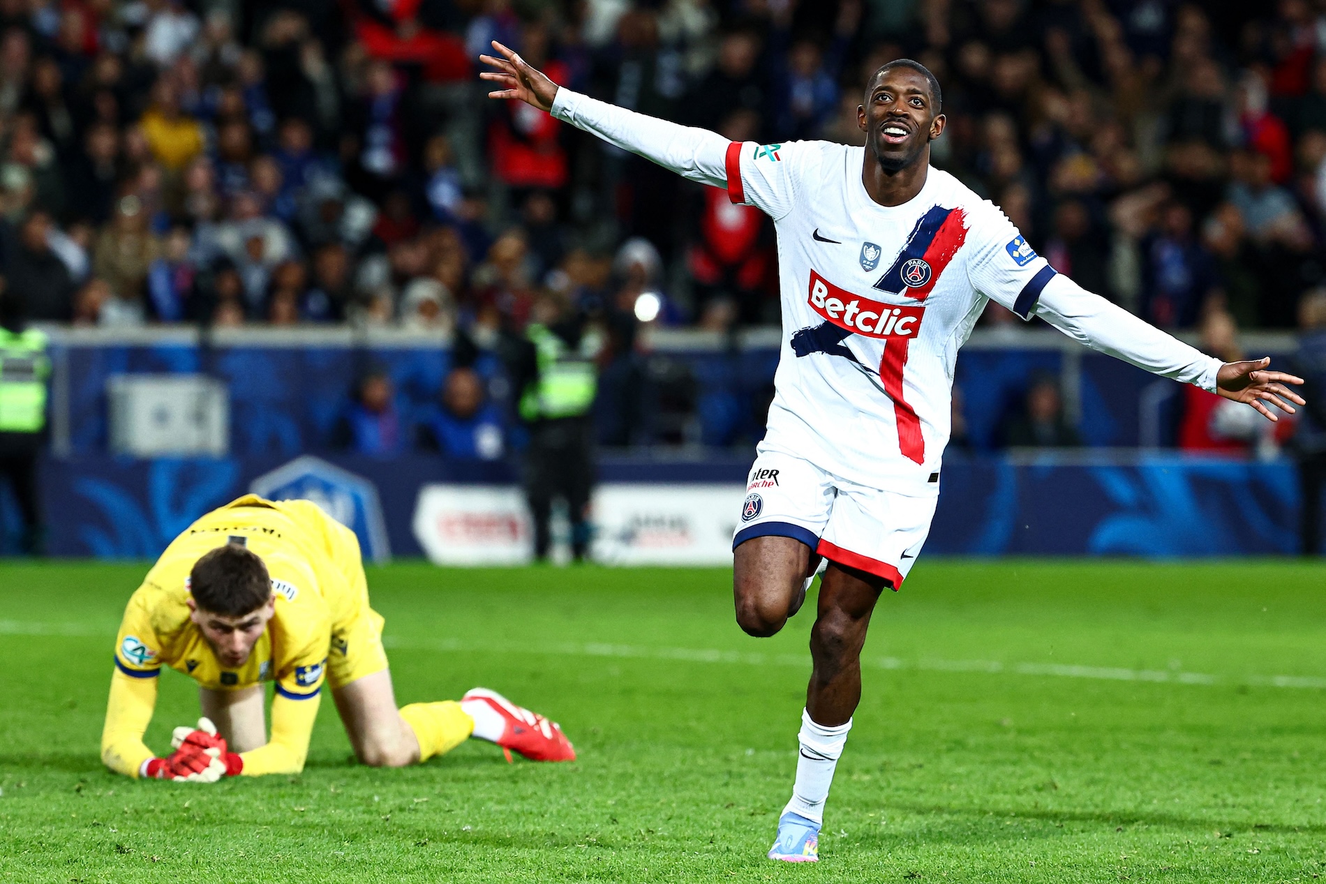 Paris Saint-Germain’s French forward Ousmane Dembele (R) celebrates after scoring his team’s fourth goal during the French Cup (Coupe de France) semifinal between USL Dunkirk and PSG at the Pierre-Mauroy stadium in Villeneuve-d’Ascq, northern France, on Tuesday. (AFP)