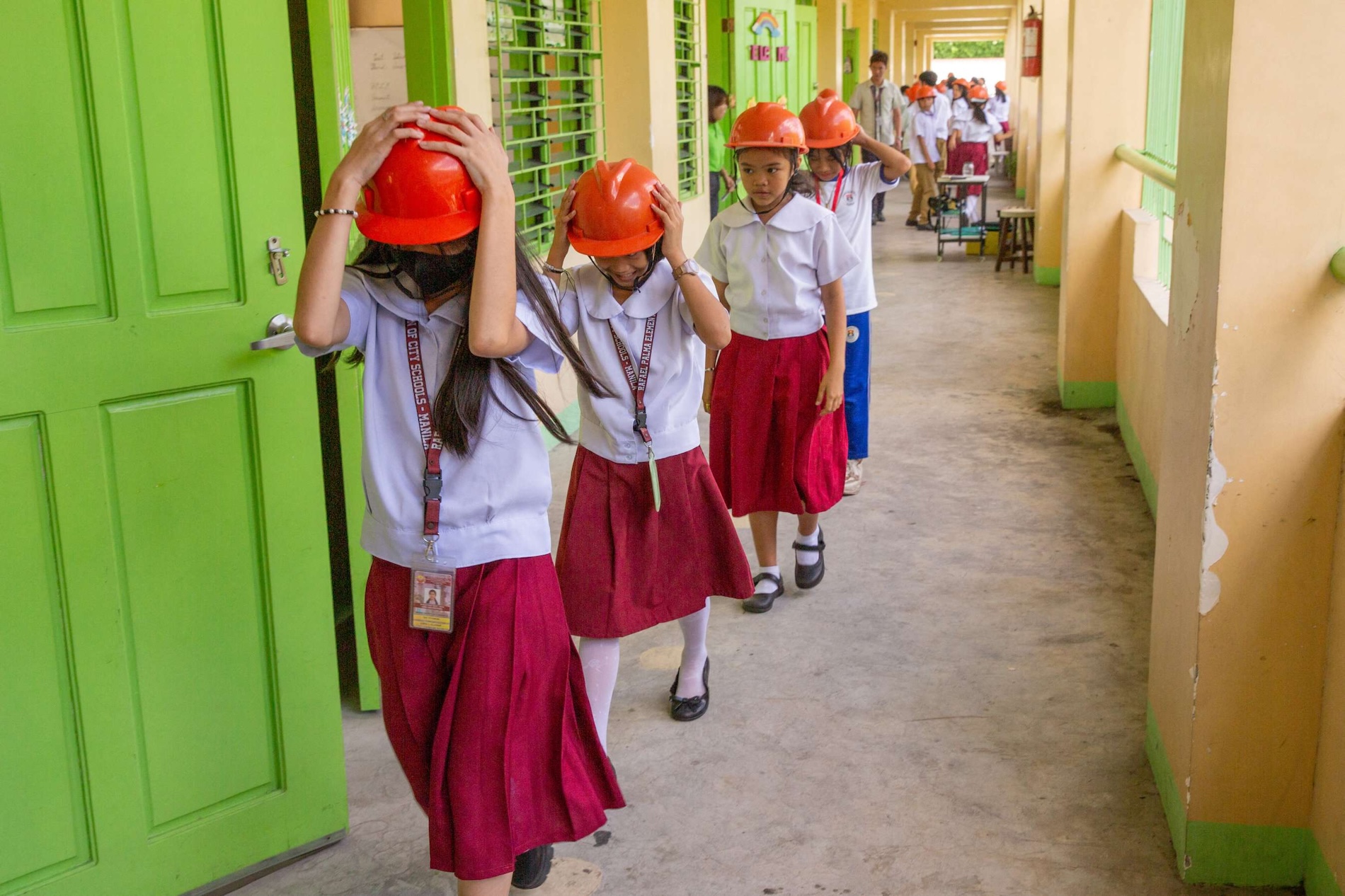In this file photo, students participate in a nationwide simultaneous earthquake drill at an elementary school in Manila on March 25, 2024. (AFP)