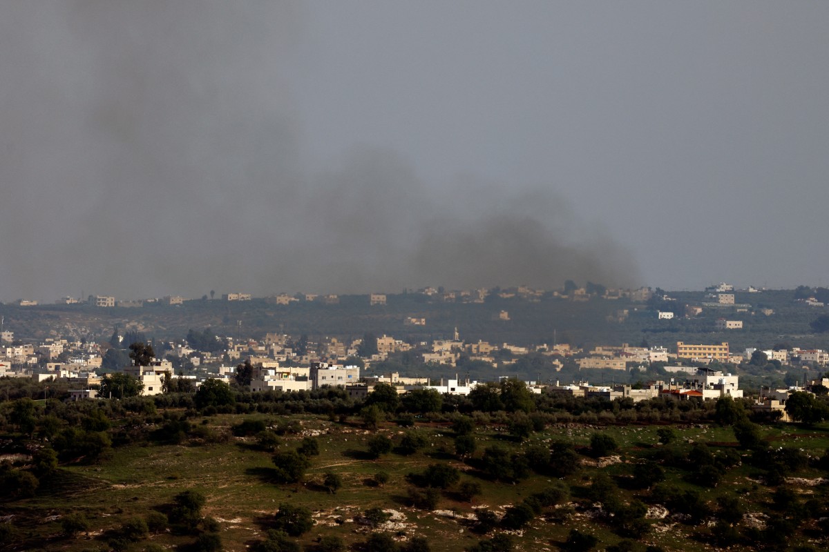This picture taken from Israel-annexed Golan Heights along the border with southern Syria shows smoke billowing above the Syrian village of Koayiah during Israeli bombardment, on March 25, 2025 (AFP)