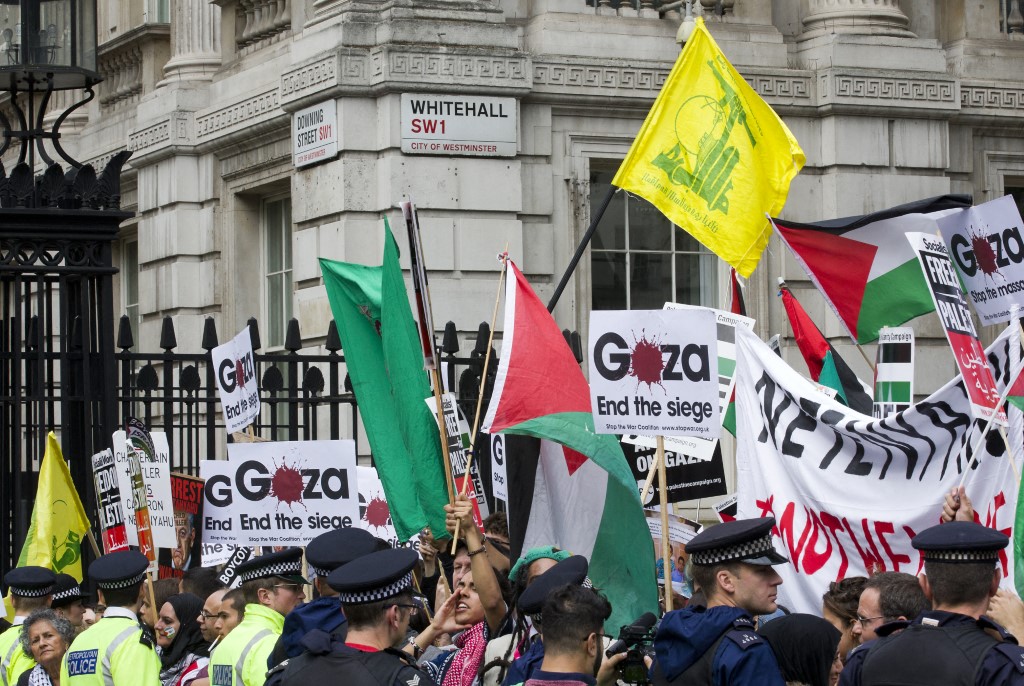 File photo Pro-palestinian demonstrators carry Palestinian flags, placards and the yellow flag of Lebanese Shiite militant group Hezbollah as they protest against a planned visit of Israeli Prime Minister Benjamin Netanyahu outside the gates of Downing Street in London on September 9, 2015.(AFP)