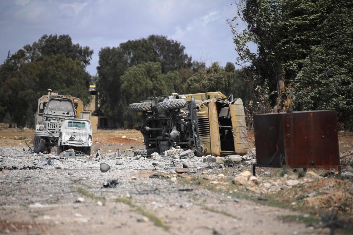 Debris and military vehicles lie at the scene of an Israeli strike in Syria’s southern Hama governorate, on Apr. 3, 2025. (AFP)