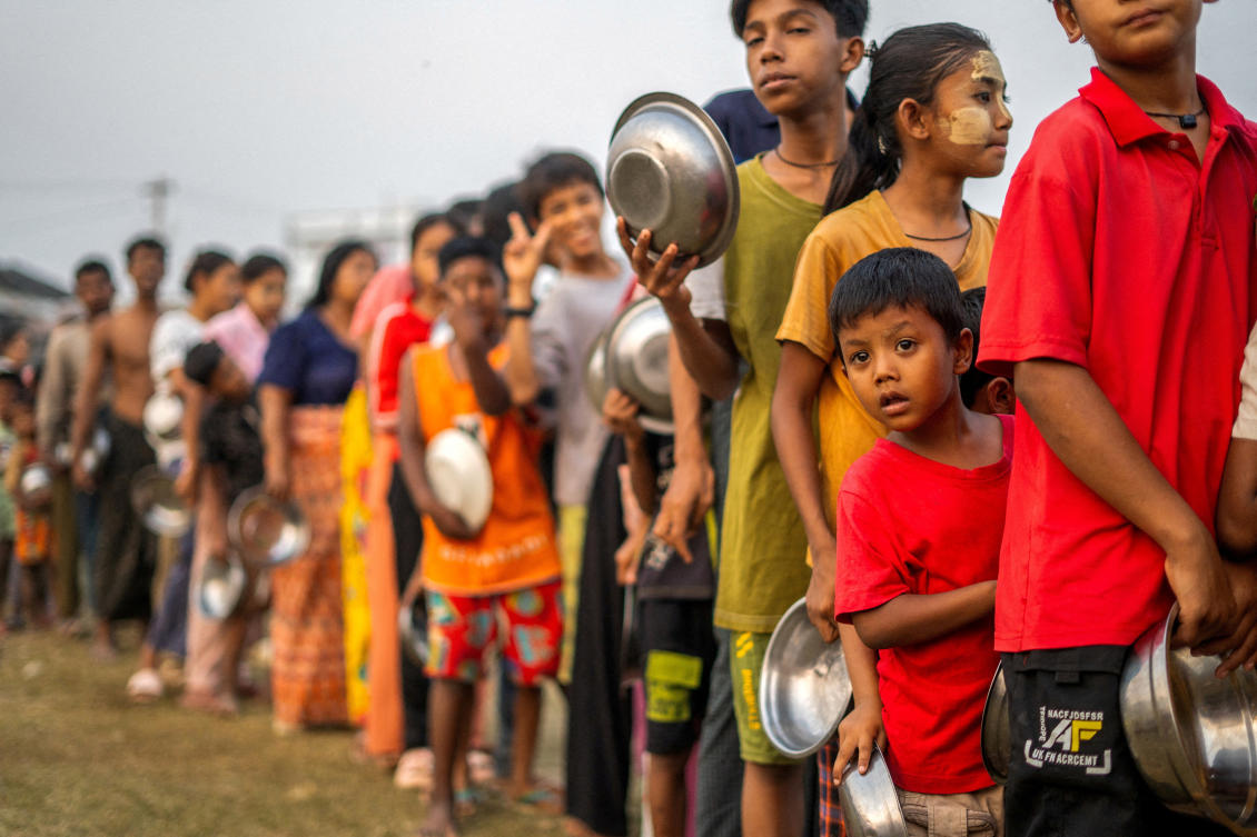 People queue for food and relief supplies after a strong earthquake in Amarapura, Myanmar on April 1, 2025. (Reuters)