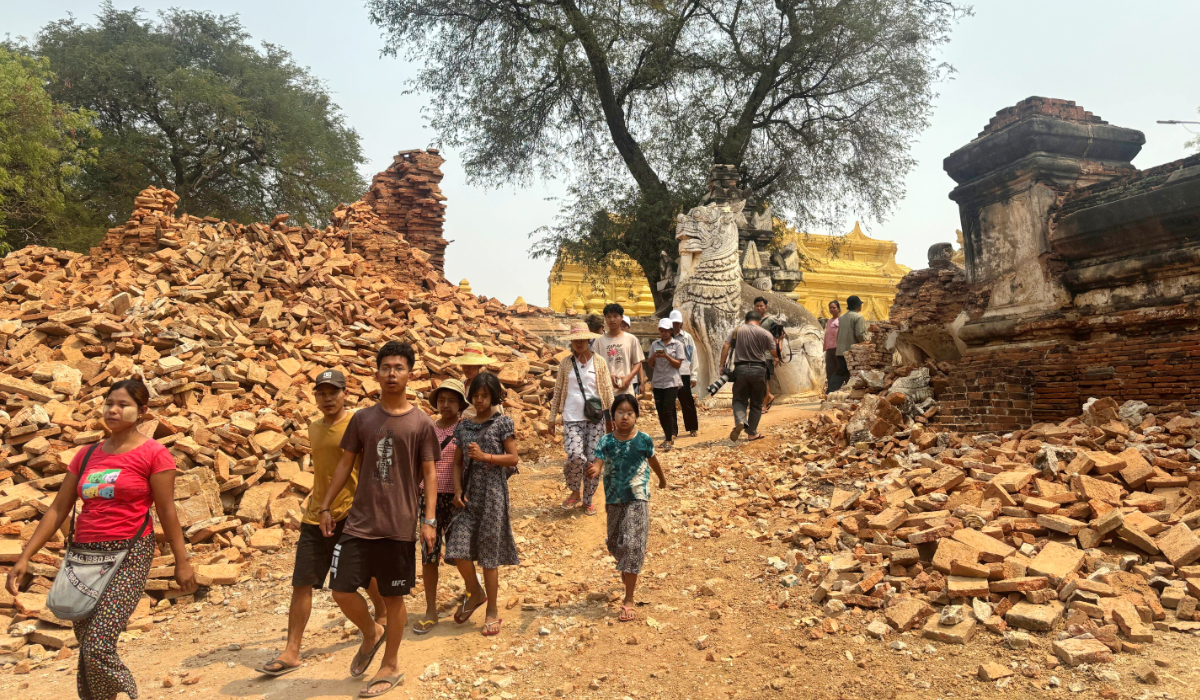 Visitors walk near entrance of Maha Aungmye Bonzan Monastery, commonly known as the Me Nu Brick Monastery, in the aftermath of Friday's earthquake in Innwa, Tada-U township, Mandalay, Myanmar, Friday, April 4, 2025. (AP)