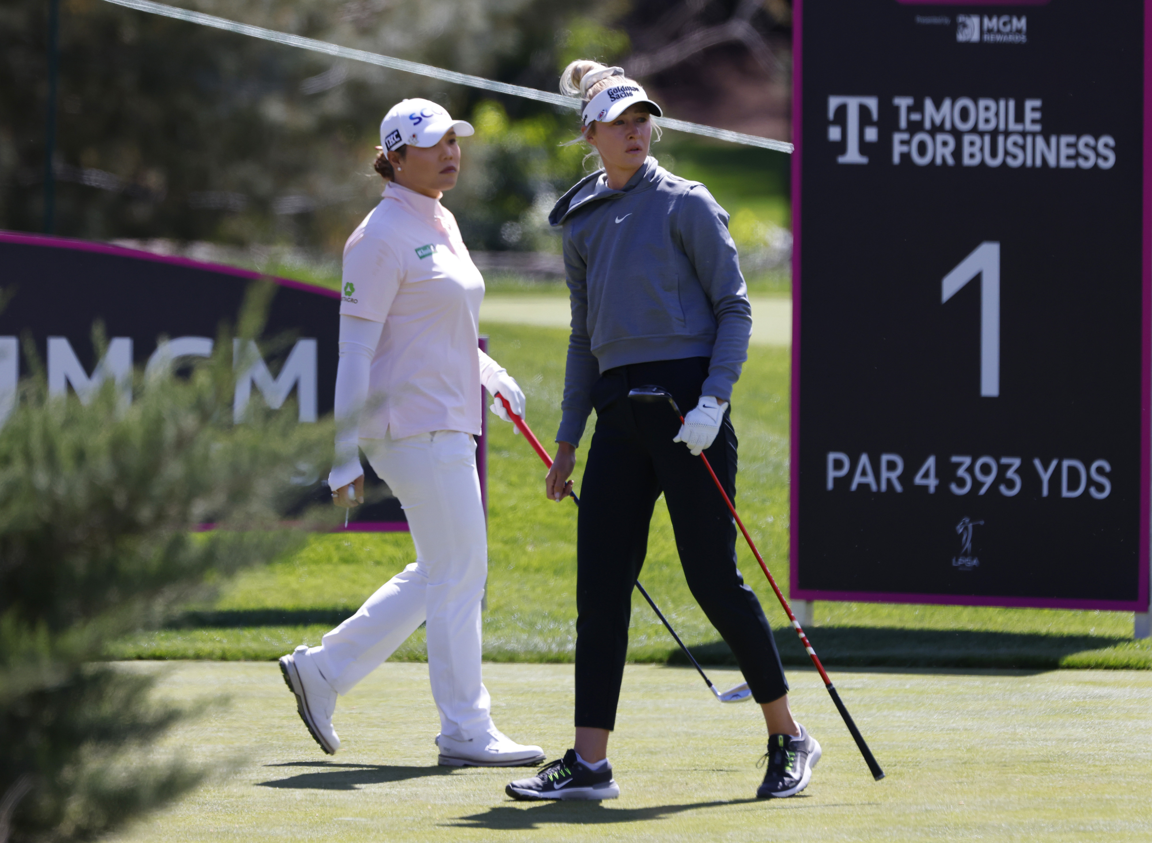 Nelly Korda, right, watches her tee shot as Ariya Jutanugarn of Thailand takes her turn during the third round of the LPGA T-Mobile Match Play golf tournament at Shadow Creek Golf Course Friday in North Las Vegas. (Las Vegas Review-Journal via AP)