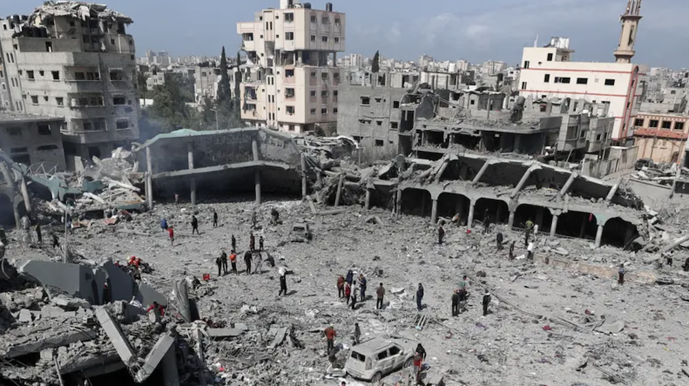Palestinians inspect the damage at the Dar Al-Arqam school, where displaced people shelter, after it was hit by an Israeli strike on Thursday, in Gaza City, April 4, 2025. (Reuters)