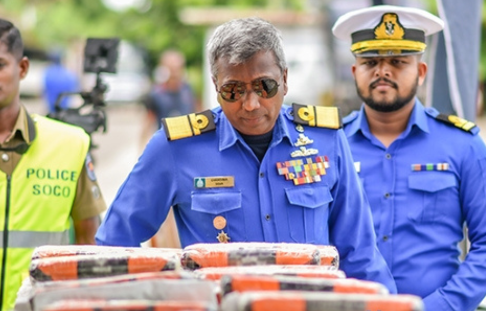A navy commander inspects packets of heroin and crystal meth seized in a special operation on April 5, 2025. (Sri Lankan Navy)