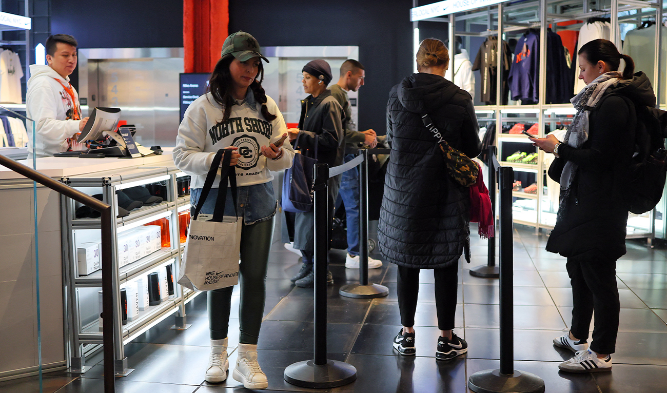 People shop at a Nike store on Fifth Avenue in New York City on April 03, 2025. (AFP)