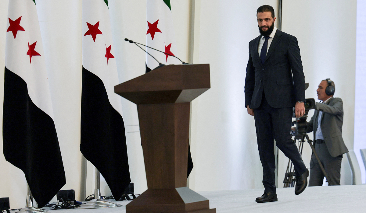 Syria's interim President Ahmed al-Sharaa walks ahead of speaking during a Ministerial formation of the government of the Syrian Arab Republic, in Damascus, Syria March 29, 2025. (REUTERS)