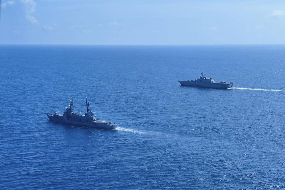 The BRP Gregorio Del Pilar, left, and USS Gabrielle Giffords sail together a military exercise in the disputed South China Sea on Feb. 9, 2024. (Armed Forces of the Philippines-Western Command/AFP)