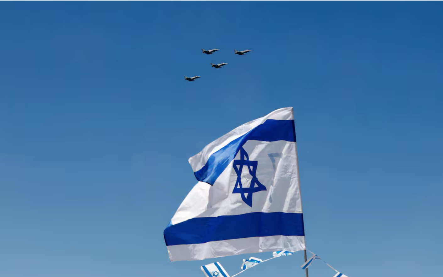 A flypast is seen over an Israeli flag as part of an aerial show, in Tel Aviv, Israel April 26, 2023. (Reuters)
