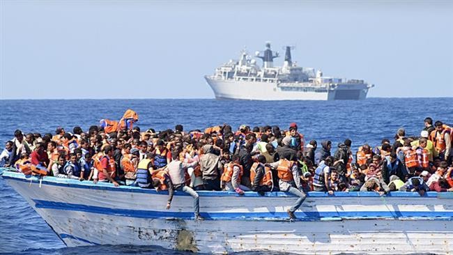 Hundreds of migrants in an overcrowded boat crossing the Mediterranean sea to Italy. (AFP/File)