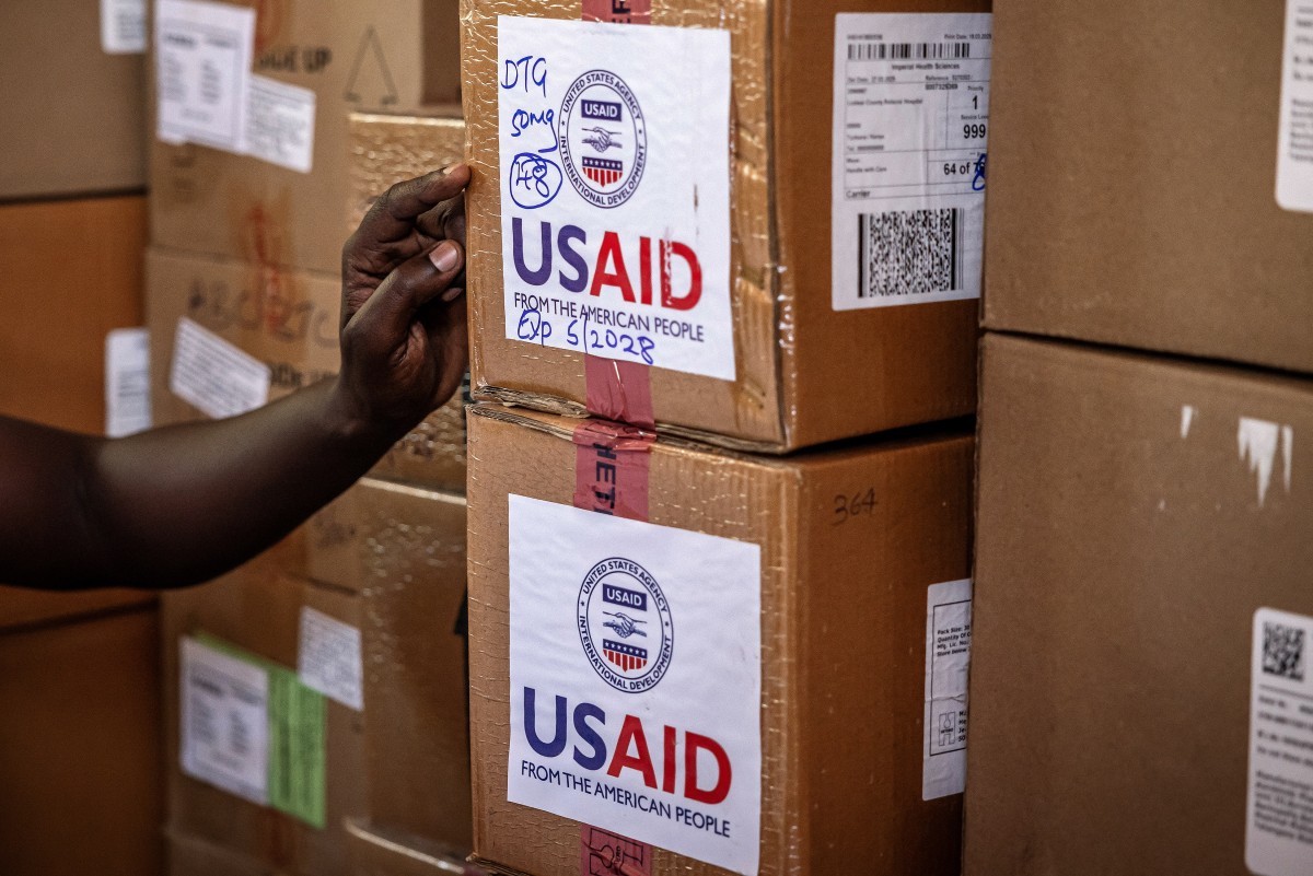 Members of the pharmacology department take inventory of the last boxes of drugs delivered by the now-dismantled USAID. (File/AFP)