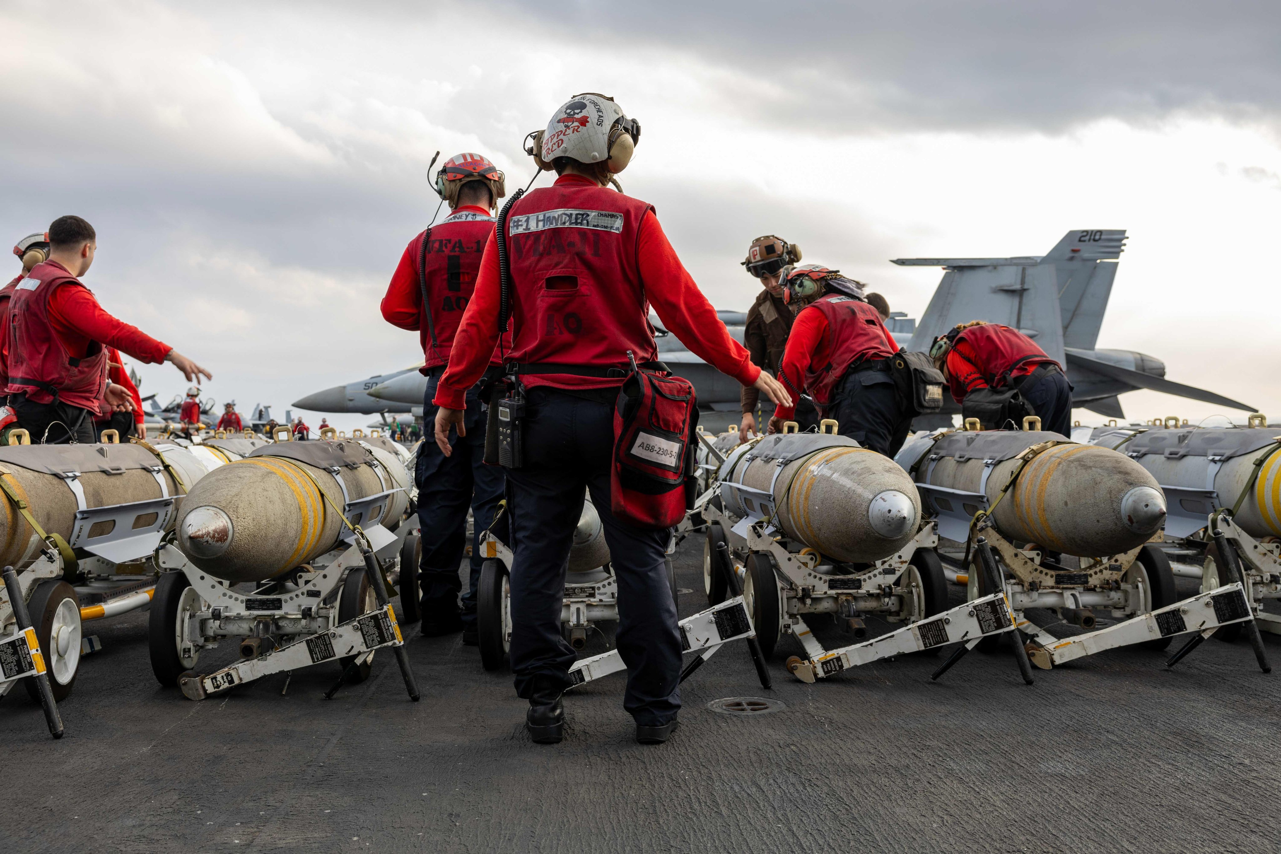 American crews arm aircraft aboard USS Harry Truman for operations against the Houthis in Yemen. (US Central Command)