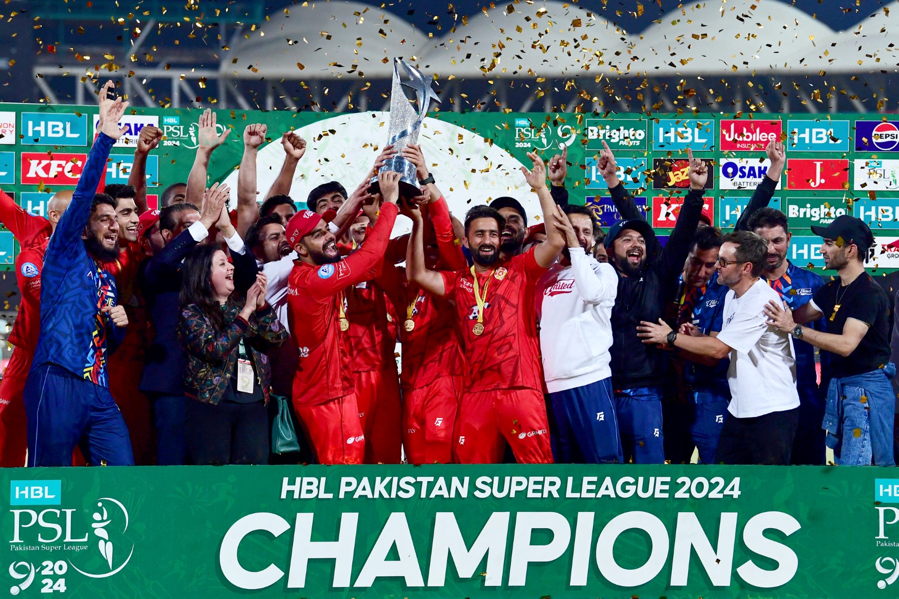 Islamabad United’s players hold the Pakistan Super League (PSL) trophy as they celebrate their victory against Multan Sultans during the award ceremony for PSL Twenty20 cricket final match at the National Stadium in Karachi on March 19, 2024. (File/AFP)