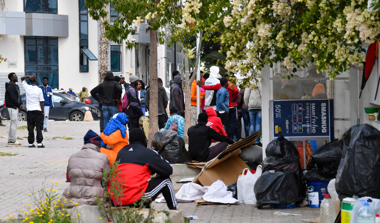 Migrants from sub-Saharan Africa wait in front of the International Organization for Migration’s headquarters in Tunis on Thursday. (AFP)
