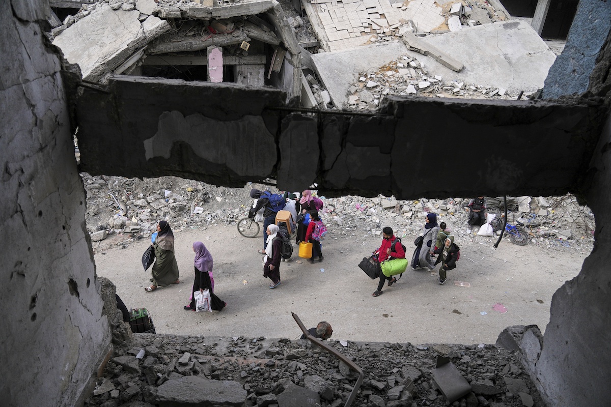Displaced Palestinians flee from east to west of Gaza City after the Israeli military issued evacuation orders in the area on Friday. (AP)