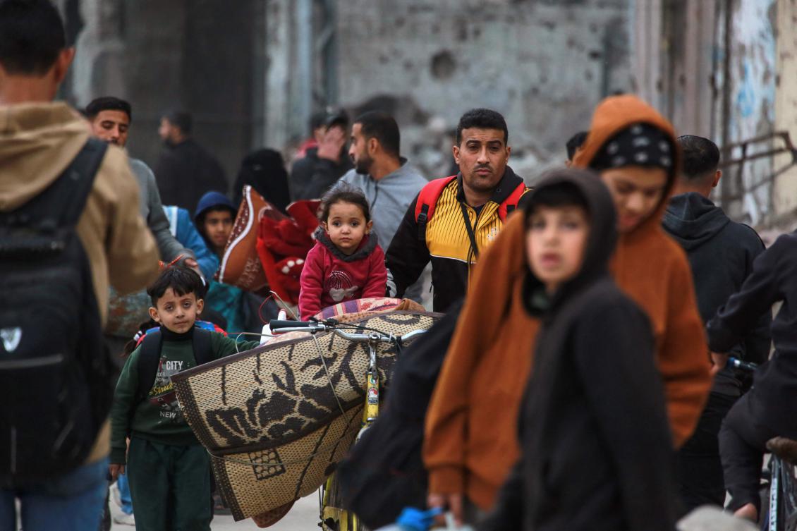 Palestinians ferry their belongings as they arrive in Gaza City to flee neighbourhoods to the east of the city following Israeli evacuation orders on April 11, 2025. (AFP)