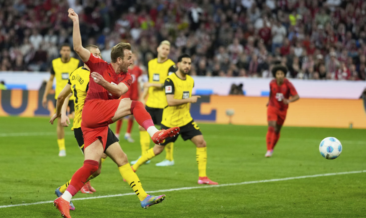 Bayern's Harry Kane makes an attempt to score during the German Bundesliga soccer match between Bayern Munich and Borussia Dortmund at the Allianz Arena in Munich, Germany, Saturday, April 12, 2025. (AP)