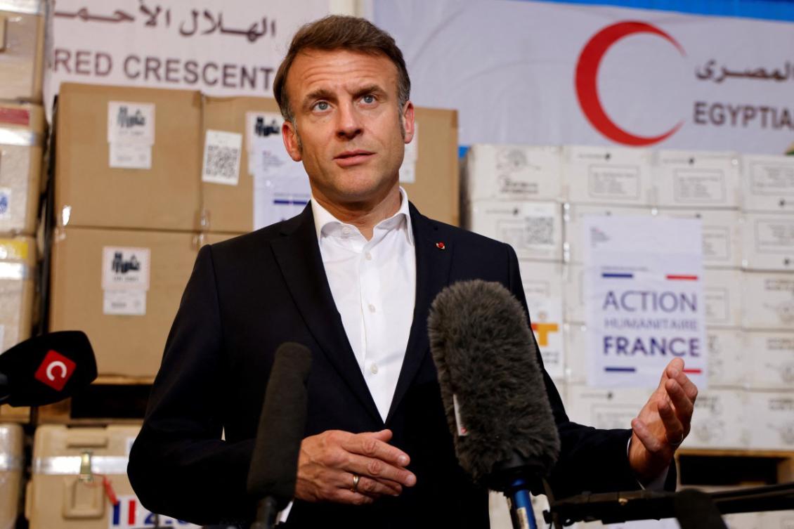 France’s President Emmanuel Macron delivers a speech in front of humanitarian aid destined to Gaza, at the Egyptian Red Crescent warehouse in Egypt. (File/AFP)