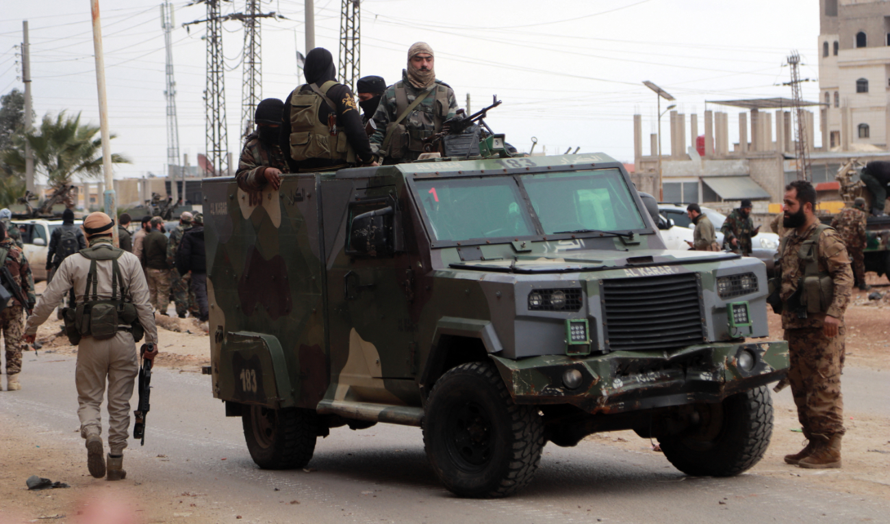 Members of Syria's new authorities security forces gather in Sanamayn, in the southern province of Daraa, during a reported large scale military campaign on March 5, 2025. (AFP/File)
