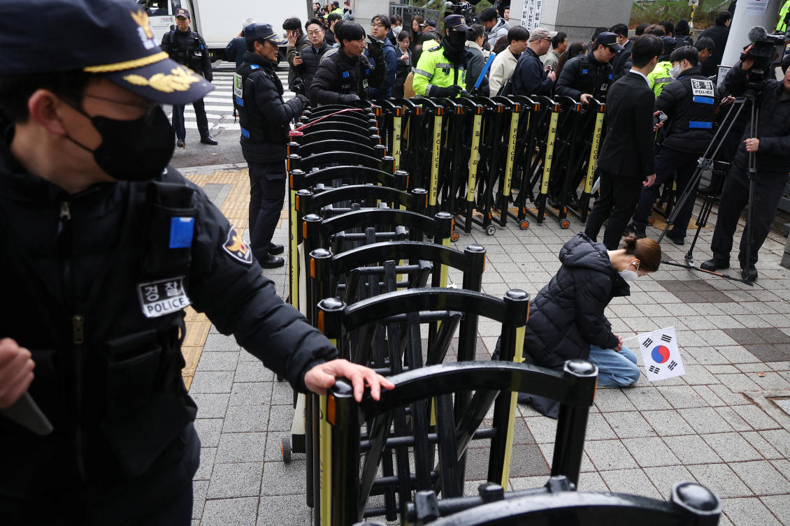 A supporter for prays South Korea’s ousted President Yoon Suk Yeol in front of Seoul Central District Court in Seoul on April 14, 2025. (Reuters)