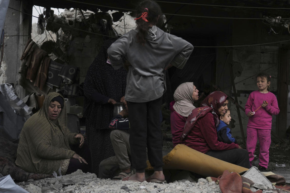 Family and neighbours watch as volunteers and emergency workers search for survivors at Manoun family's house after it was targeted by an Israeli army strike in Jabalia al-Balad, Gaza City, Sunday, April 13, 2025. (AP)