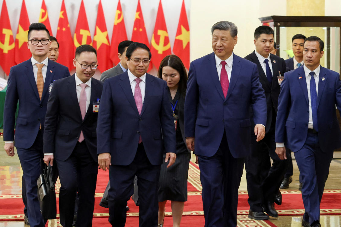 Vietnamese Prime Minister Pham Minh Chinh, center-left, and Chinese President Xi Jinping, center right, in Hanoi on April 14, 2025. (Reuters)