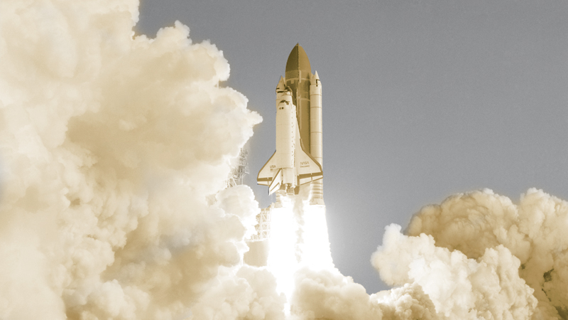 Clouds of exhaust blanket Launch Pad 39A at NASA’s Kennedy Space Center as the space shuttle Discovery lifts off for the first time in August 1984. NASA