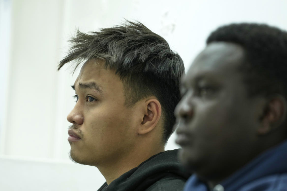 Vietnamese national Duh Hung Nguyen, left, and Kenyan national Dennis Ng’ang’a who are charged to the illegal possession and trafficking of live queen ants to sell as exotic pets, appear at the Jomo Kenyatta International Airport Law Courts in Nairobi. (AP)