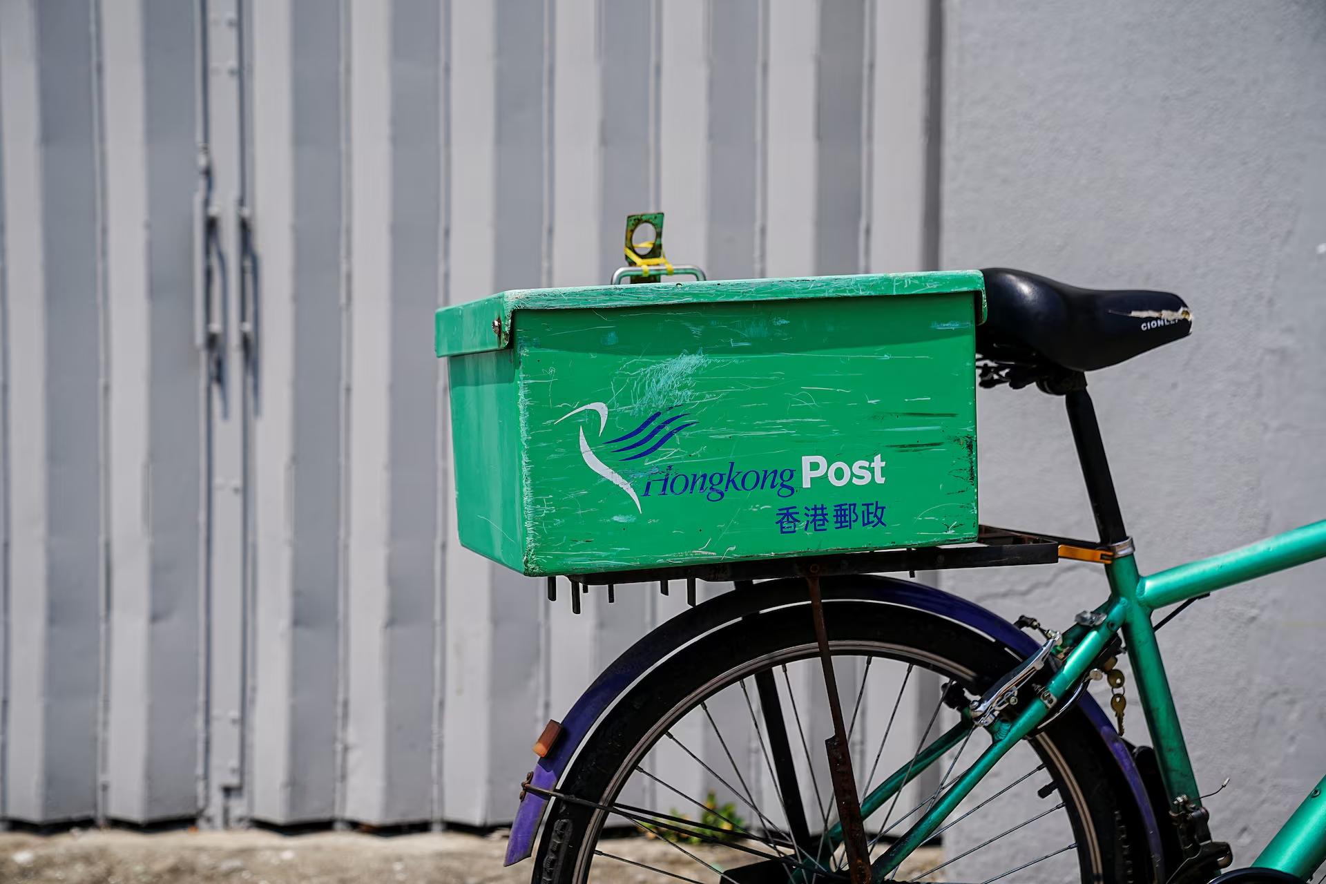 A postal bicycle is parked outside a post office in Hong Kong, China April 9, 2025. REUTERS/Lam Yik/File Photo