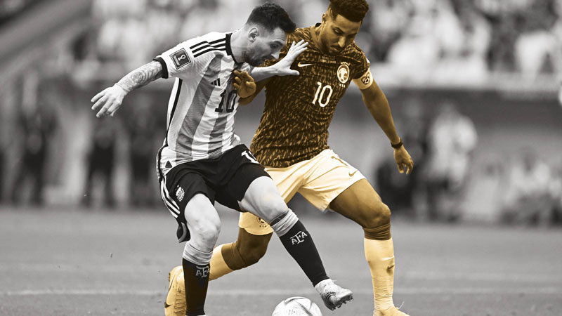 Salem Al-Dawsari battles with Messi during the Green Falcons’ historic 2-1 first round win. AFP