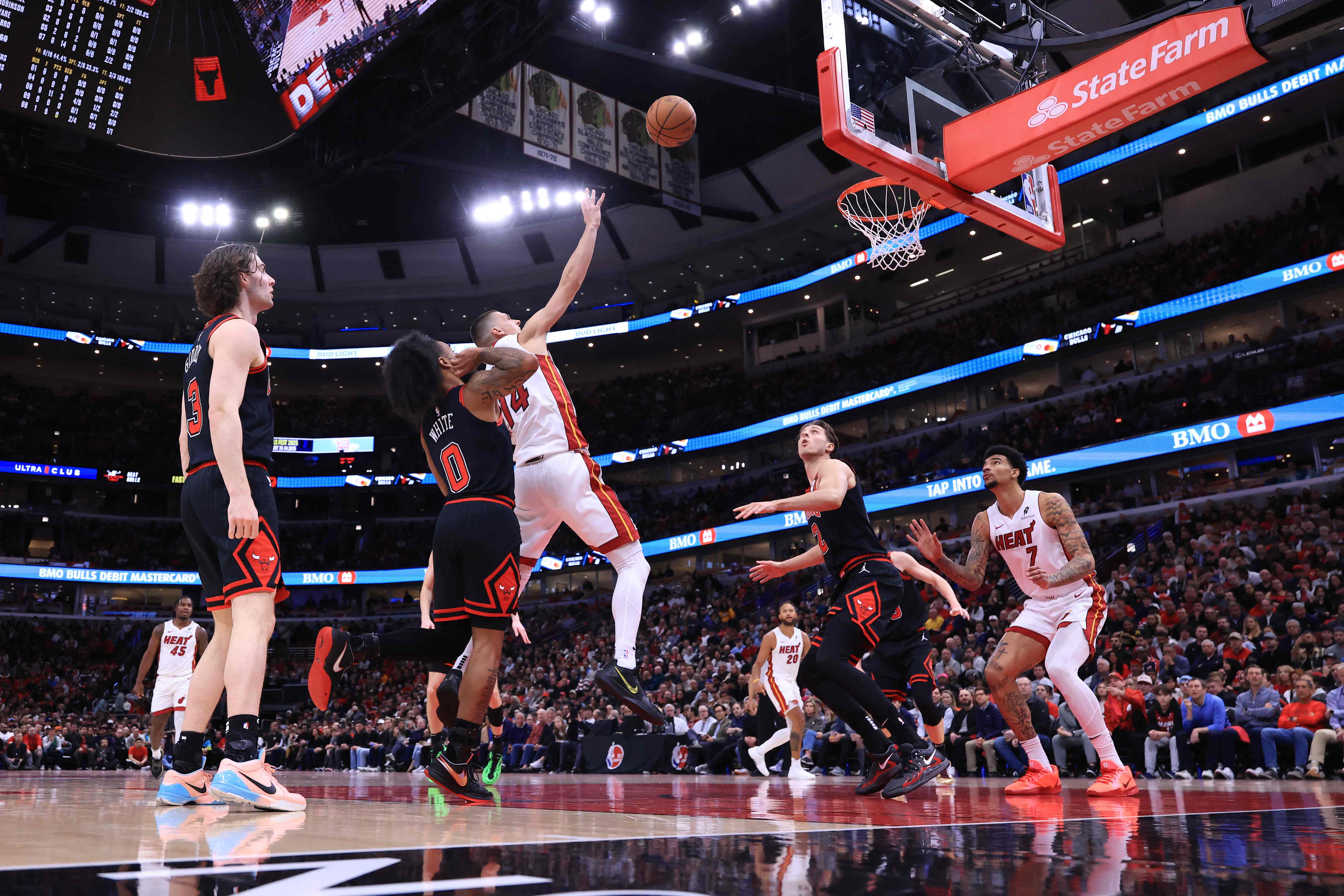 Tyler Herro of the Miami Heat takes a shot over Coby White of the Chicago Bulls during the first half of the Play-In Tournament at the United Center on Wednesday in Chicago. (