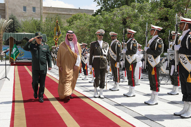 Chief of Iranian Armed Forces, Mohammad Bagheri, welcomes Prince Khalid in Tehran. (Reuters)