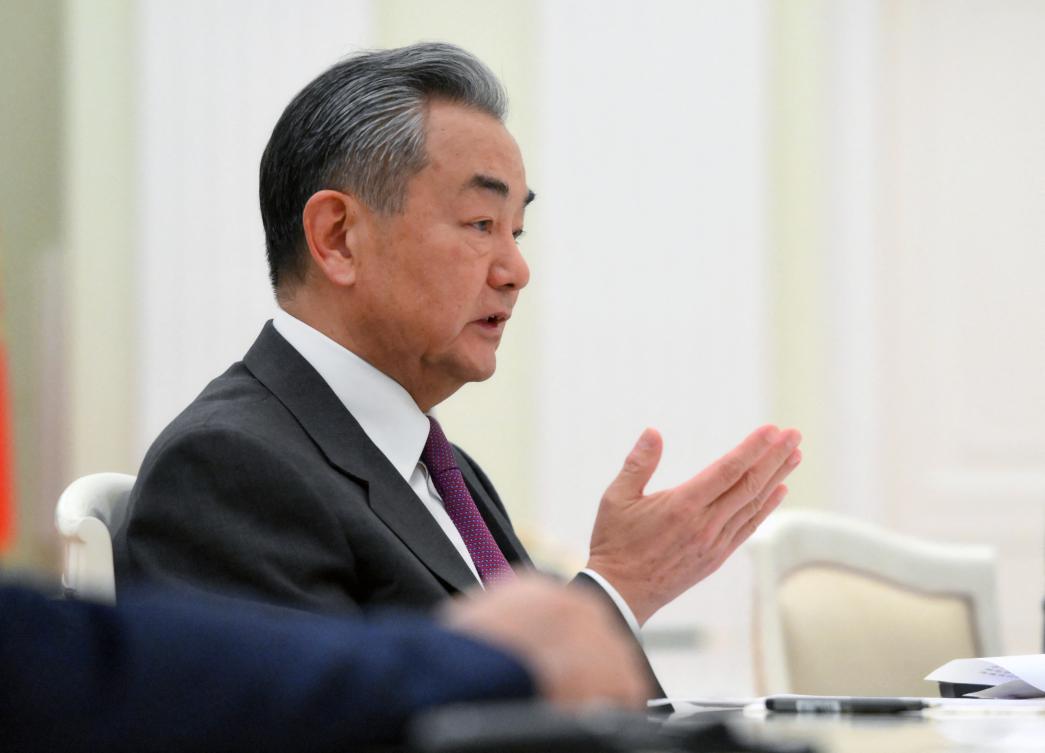 Chinese Foreign Minister Wang Yi attends a meeting with Russia's President at the Kremlin