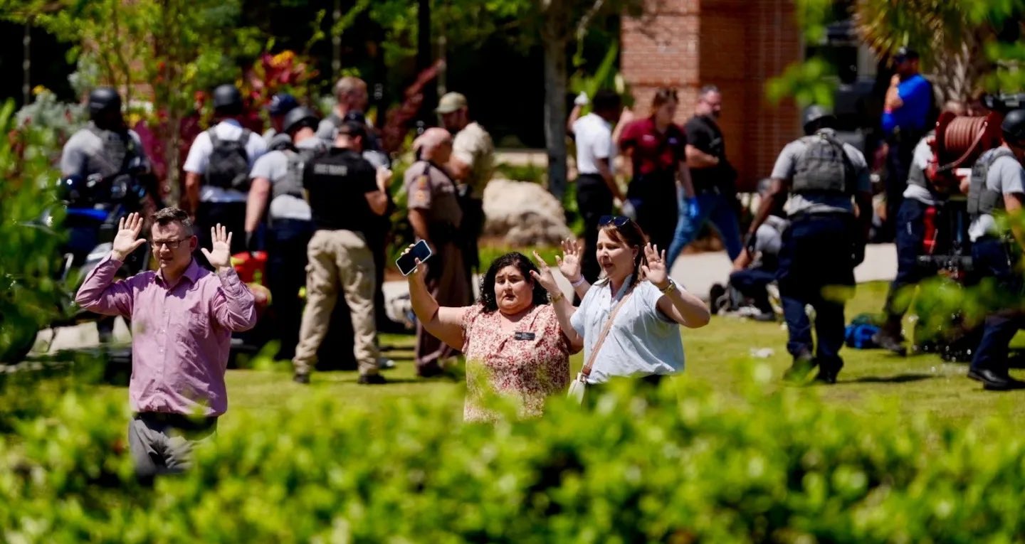 Footage on social media showed a stream of young adults walking through corridors with their hands in the air as they evacuated the building.(X/@Bubblebathgirl)
