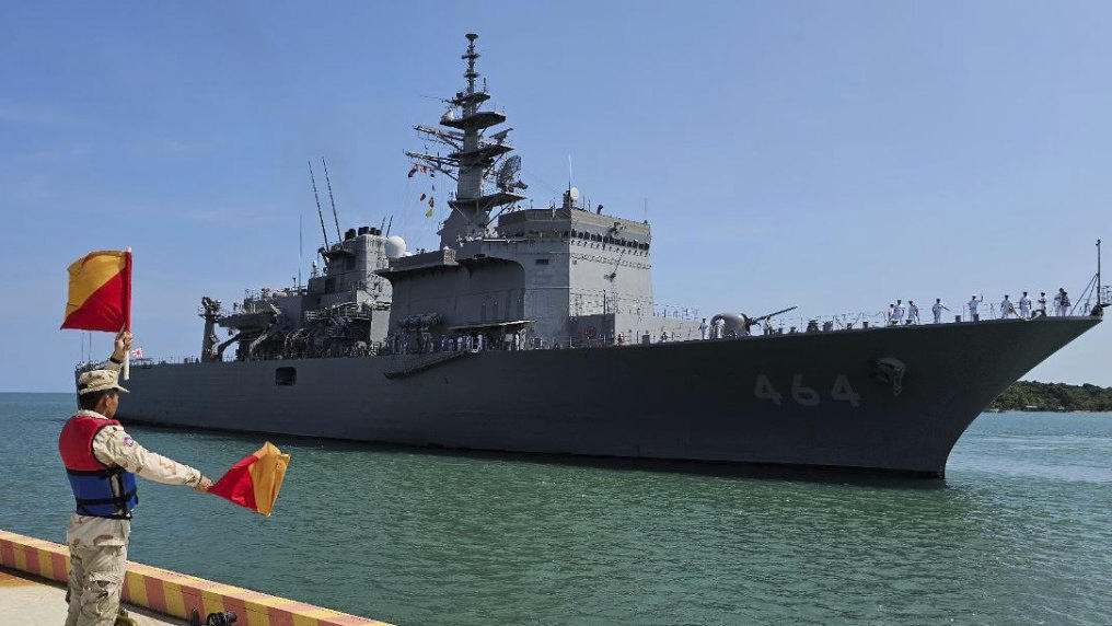 In this photo released by Cambodia’s Ream Naval Base, a Cambodian navy officer guides a Japanese warship as it docks at a naval base’s pier during a four-day visit at the Ream Naval Base in Sihanoukville, southwestern of Phnom Penh, Cambodia, Apr. 19, 2025. (AP)