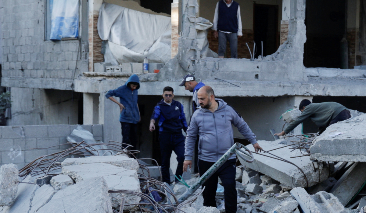 Palestinians gather at the site of an Israeli strike on a house, in Khan Younis in the southern Gaza Strip April 19, 2025. (REUTERS)