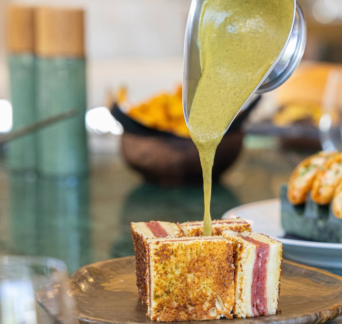 The Croque Sando at Beefbar — golden, crisp, and topped with a rich green sauce. Visually impressive, but taste-wise? A bit too safe for the hype. (Supplied)
