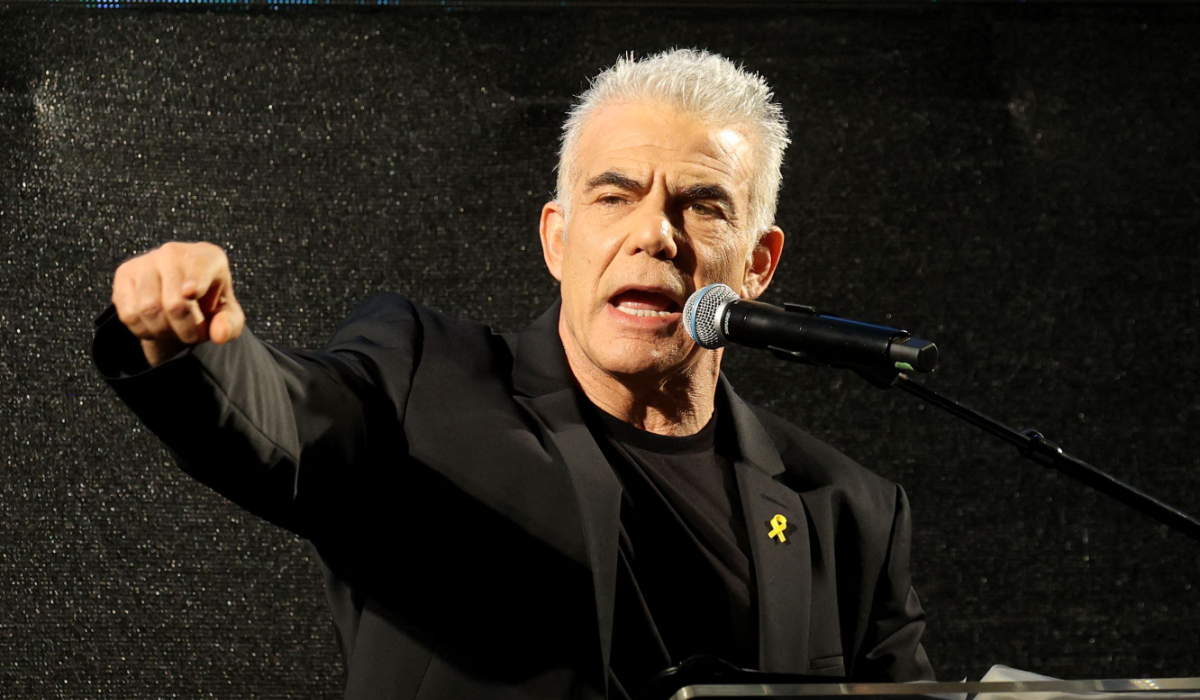Israeli opposition leader Yair Lapid addresses an anti-government rally in Tel Aviv on July 20, 2024, amid the ongoing conflict in the Gaza Strip between Israel and the Palestinian militant Hamas movement. (AFP)