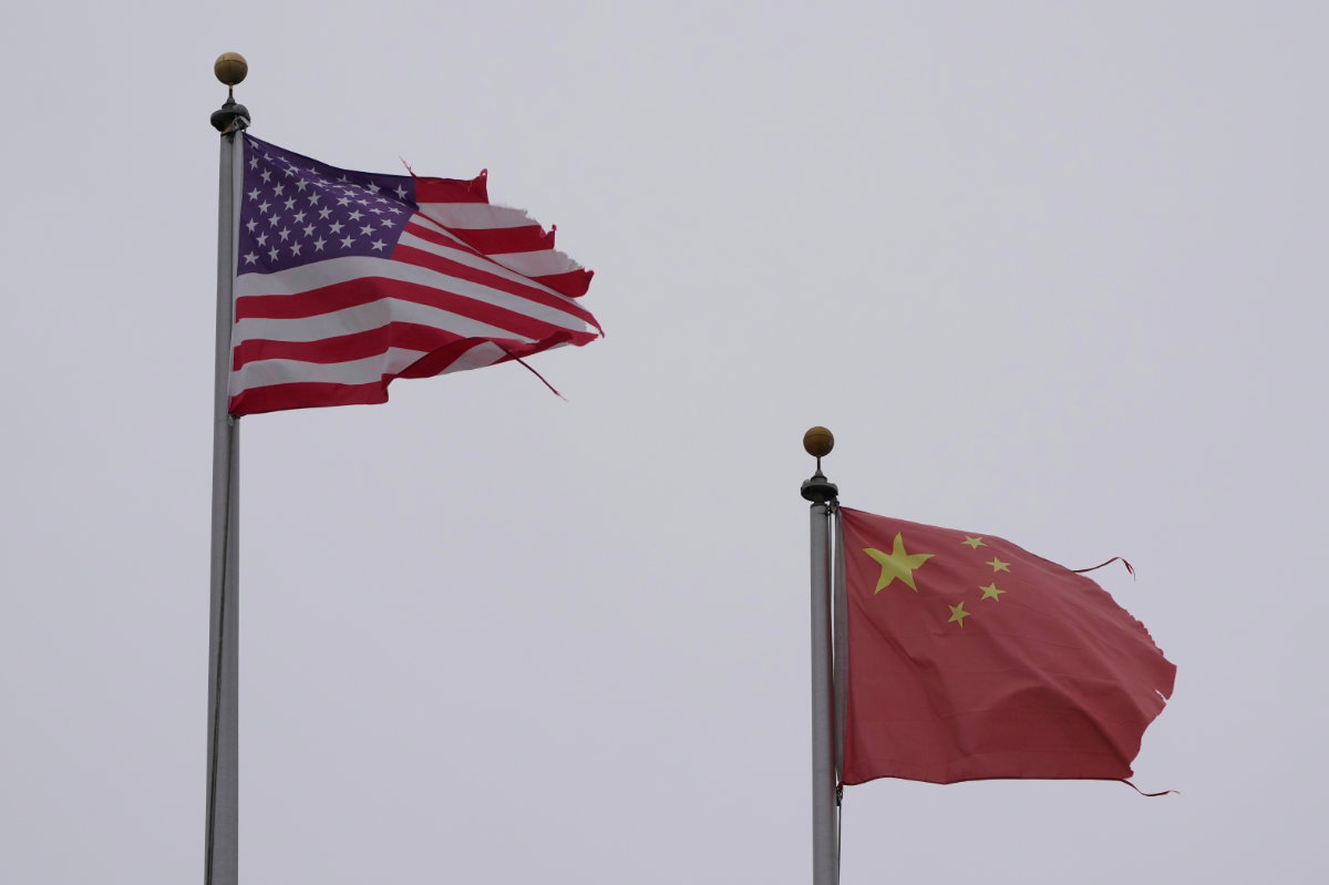 A flag of the United States flies next to a flag of China in Chinatown, San Francisco, on April 18, 2025. (AP Photo)